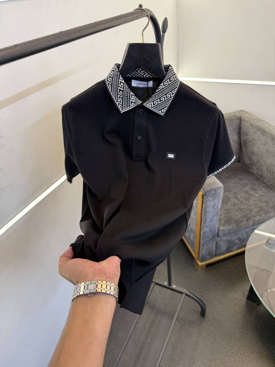 Versace black imported polo tshirt with brand buttons and knitted collar with sleeves