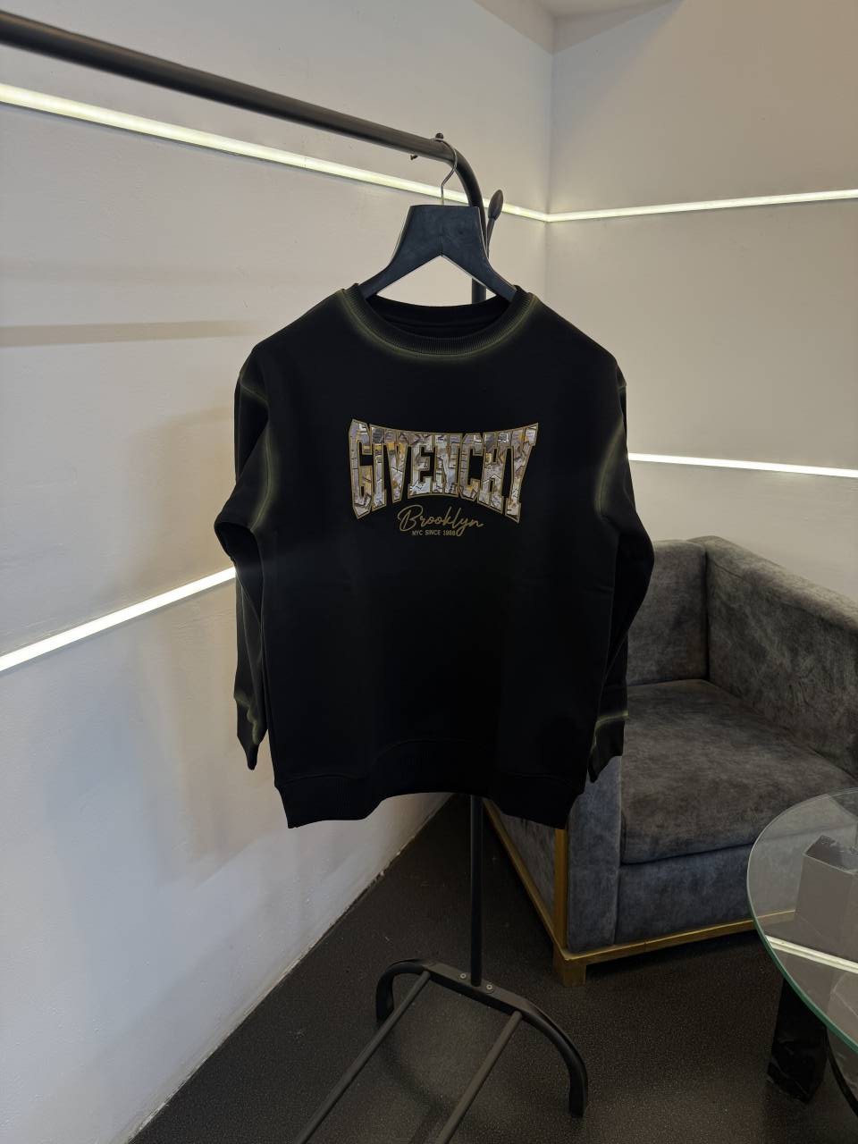 Givenchy imported fleece sweatshirt with spray print and front branding black