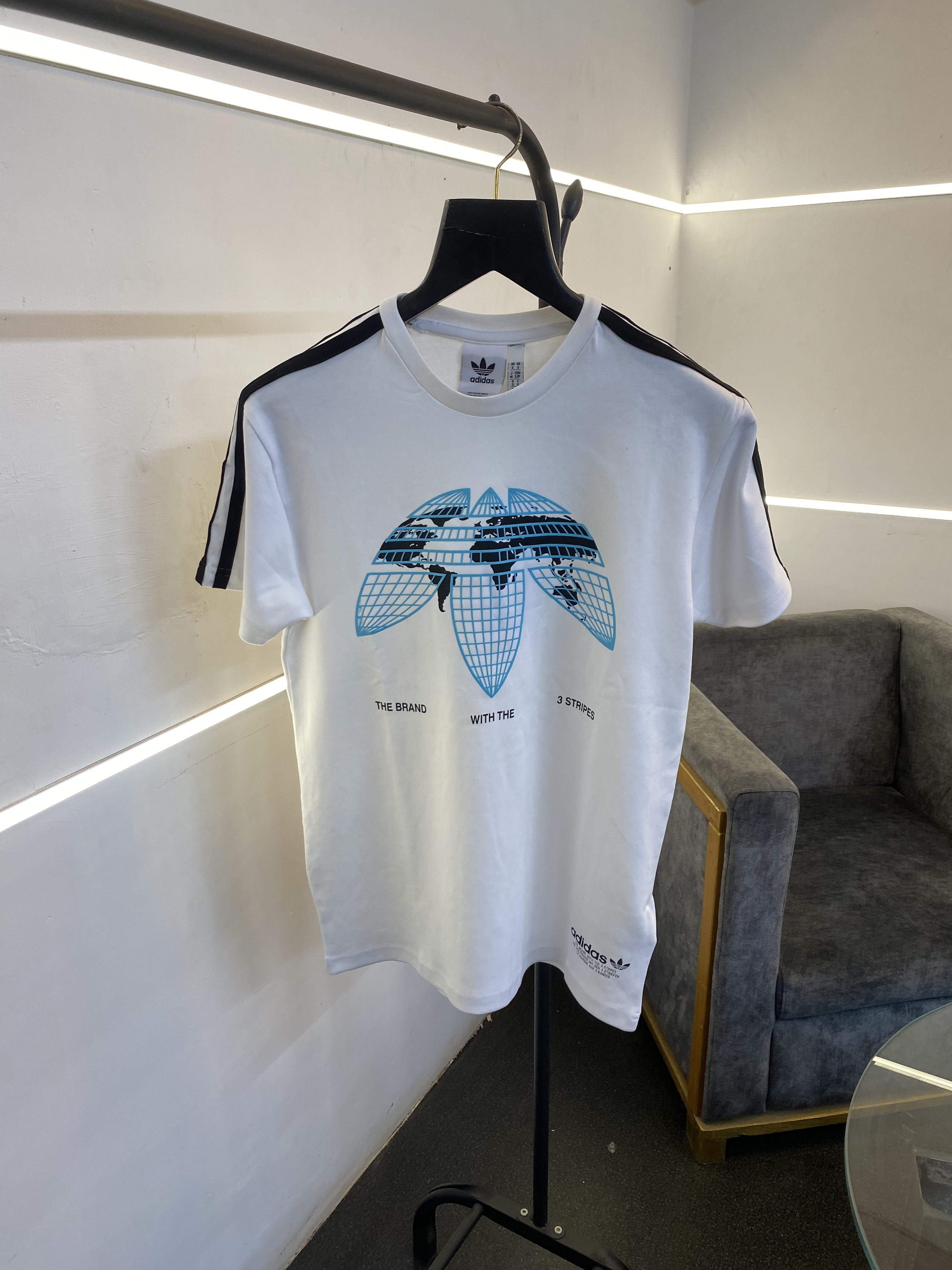 Adiddas round neck imported tshirt world map print in front and three strips on shoulder
