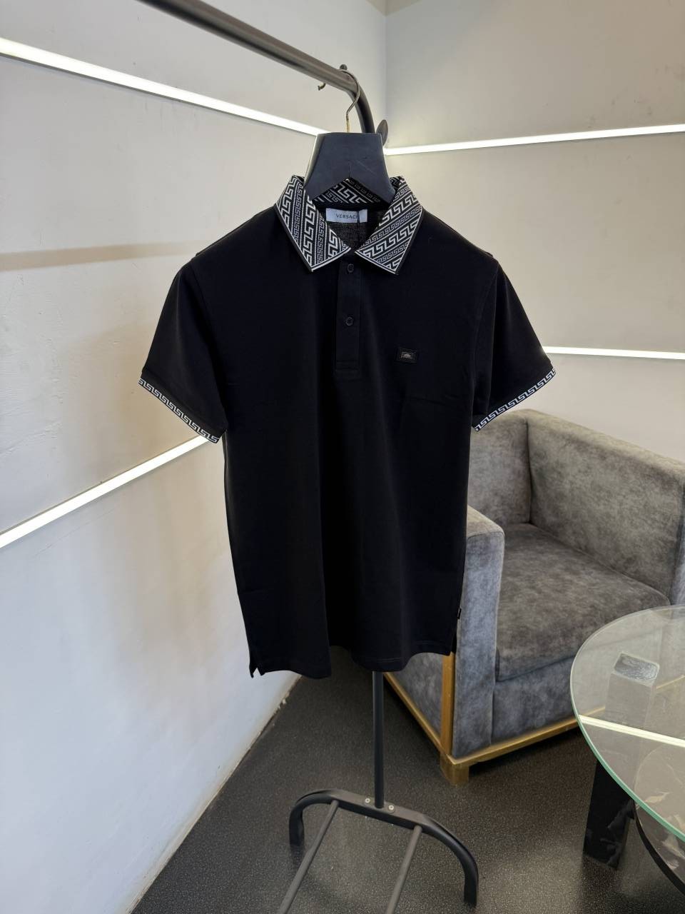Versace black imported polo tshirt with brand buttons and knitted collar with sleeves